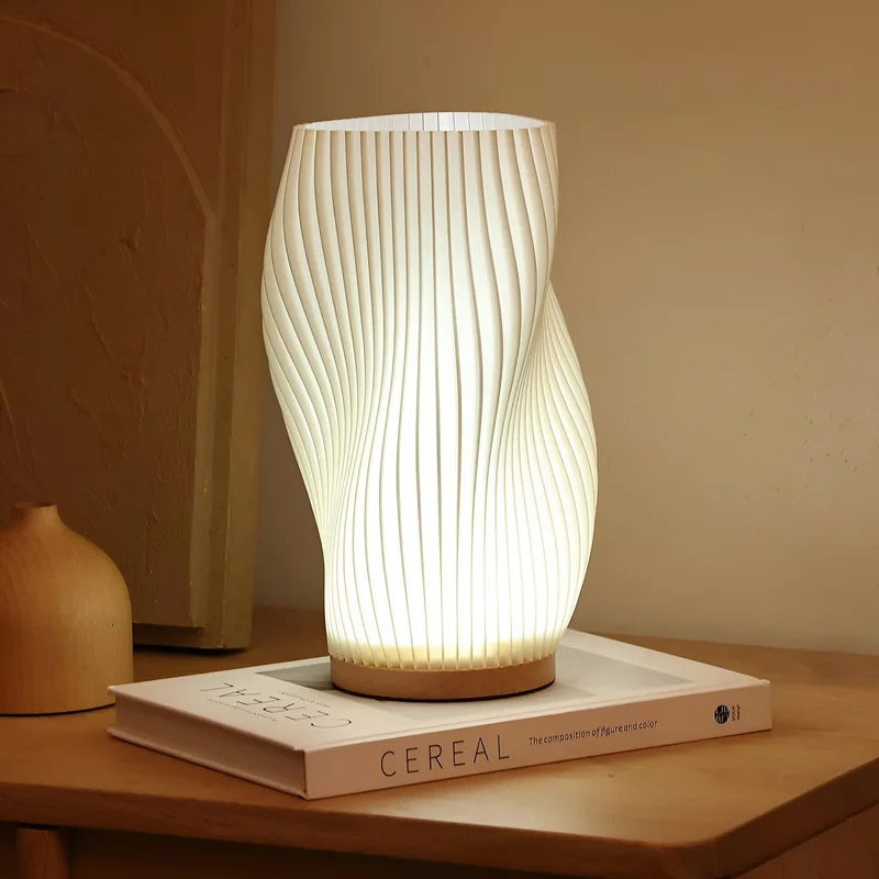DreamWave - Modern krämfärgad 3D våglampa med elegant metallbas | Veska